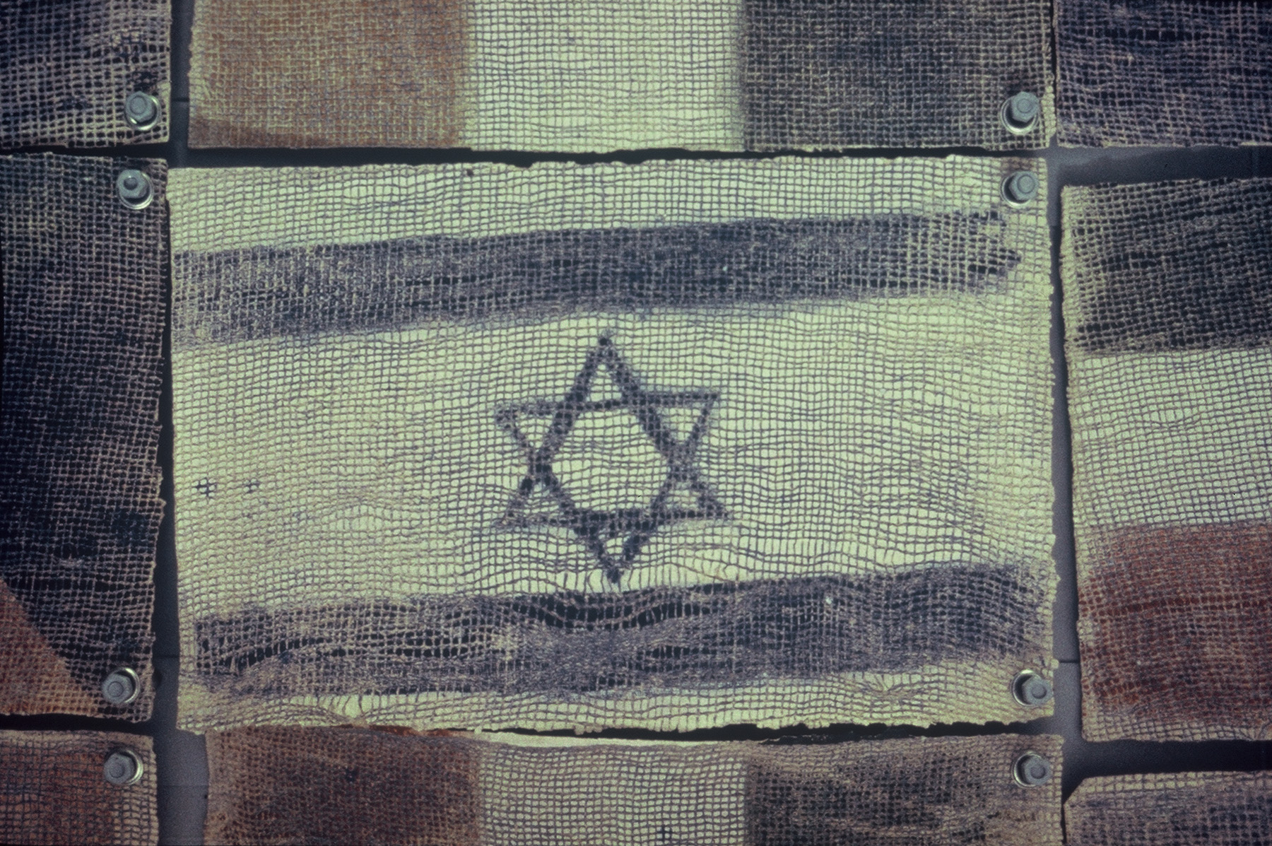 Fabric with flag paintd on featuring two horizontal stripes with the star of david between them